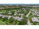 Aerial view of the community with mature trees, manicured lawns, and easy access to roadways at 4505 Kingsmere # 2, Sarasota, FL 34235