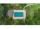 An aerial view of a community swimming pool with lounge chairs and landscaping at 4505 Kingsmere # 2, Sarasota, FL 34235
