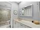 Well-lit bathroom with a spacious shower, vanity, and modern fixtures at 4505 Kingsmere # 2, Sarasota, FL 34235
