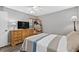 Bright bedroom with dresser, TV, ceiling fan, and ample natural light at 4505 Kingsmere # 2, Sarasota, FL 34235