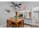 Cozy dining area with vaulted ceilings, view to kitchen and backyard at 4505 Kingsmere # 2, Sarasota, FL 34235