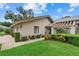 Beautiful one-story home with well-maintained landscaping, a covered entry and a two car garage at 4505 Kingsmere # 2, Sarasota, FL 34235