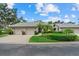 Charming single story home featuring an attached garage, lush landscaping, and a well-manicured lawn at 4505 Kingsmere # 2, Sarasota, FL 34235