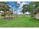 Scenic view of a lush golf course with mature trees and landscaping surrounding the beautiful condos at 4505 Kingsmere # 2, Sarasota, FL 34235