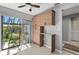 Bright kitchen with lots of storage cabinets and large sliding glass doors to outdoor gardens at 4505 Kingsmere # 2, Sarasota, FL 34235
