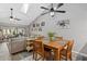 Open-concept living room and dining area with vaulted ceilings and lots of natural light at 4505 Kingsmere # 2, Sarasota, FL 34235