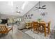 Comfortable living area with luxury vinyl floors, vaulted ceilings, and a sliding door to the lanai at 4505 Kingsmere # 2, Sarasota, FL 34235