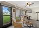 Bright living room with patio access, ceiling fan, decor, and comfortable seating area at 4505 Kingsmere # 2, Sarasota, FL 34235