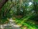 A nature trail with a wooden bridge and lush greenery at 4505 Kingsmere # 2, Sarasota, FL 34235