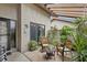 A private patio with comfortable seating surrounded by lush greenery creates a relaxing outdoor space at 4505 Kingsmere # 2, Sarasota, FL 34235