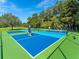 Outdoor pickleball courts offer recreational fun under sunny skies in this active community at 4505 Kingsmere # 2, Sarasota, FL 34235