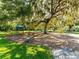 A community playground with swings and lush green grass at 4505 Kingsmere # 2, Sarasota, FL 34235