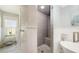The bathroom has a tiled walk-in shower with a seat, a window for natural light, and wainscoting at 4665 Pine Harrier Dr, Sarasota, FL 34231