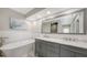 This elegant bathroom features a soaking tub, a double sink vanity with marble countertop, and modern fixtures at 4665 Pine Harrier Dr, Sarasota, FL 34231