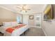 This cozy bedroom features a comfortable bed, soft carpeting, and easy access to an ensuite bathroom at 4665 Pine Harrier Dr, Sarasota, FL 34231