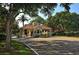 The Landings community gate house featuring classic architecture and beautiful landscaping at 4665 Pine Harrier Dr, Sarasota, FL 34231