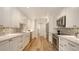 Modern kitchen with white cabinets, quartz countertops, and stainless steel appliances at 4665 Pine Harrier Dr, Sarasota, FL 34231