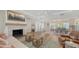 Bright living room with a fireplace, hardwood floors, and an open floor plan at 4665 Pine Harrier Dr, Sarasota, FL 34231