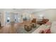 Spacious living room featuring hardwood floors, recessed lighting, and a neutral color palette at 4665 Pine Harrier Dr, Sarasota, FL 34231