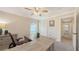 This office features a spacious desk, neutral paint, and views to an ensuite bathroom at 4665 Pine Harrier Dr, Sarasota, FL 34231