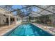 Sparkling in-ground screened pool perfect for cooling off on warm days and enjoying Florida outdoor living at 4665 Pine Harrier Dr, Sarasota, FL 34231
