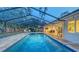 Inviting in-ground screened pool with an adjacent patio area, perfect for enjoying outdoor gatherings at 4665 Pine Harrier Dr, Sarasota, FL 34231