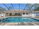 Beautiful screened pool with tile trim and outdoor patio area, ideal for relaxation and entertaining at 4665 Pine Harrier Dr, Sarasota, FL 34231