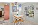 Bright dining area with large window and decorative wall art at 4869 Village Gardens Dr # 189, Sarasota, FL 34234
