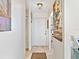 Bright hallway leading to living spaces with tile flooring and neutral decor at 4869 Village Gardens Dr # 189, Sarasota, FL 34234