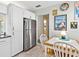 Bright kitchen includes stainless steel refrigerator and eat in dining area at 4869 Village Gardens Dr # 189, Sarasota, FL 34234