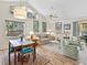 Inviting living room with vaulted ceilings, wooden floors and comfortable seating at 4869 Village Gardens Dr # 189, Sarasota, FL 34234