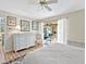 Light-filled bedroom features a ceiling fan, neutral walls, and sliding glass door, creating a serene and inviting space at 4869 Village Gardens Dr # 189, Sarasota, FL 34234