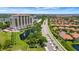 Breathtaking aerial shot highlighting lush landscaping and community with red tile roofs at 501 Haben Blvd # 506, Palmetto, FL 34221