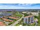 Breathtaking aerial view showcasing luxury tower, community, and scenic surroundings at 501 Haben Blvd # 506, Palmetto, FL 34221