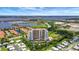 Stunning aerial view showcases waterfront condo, boat docks and the intercoastal waterway beyond at 501 Haben Blvd # 506, Palmetto, FL 34221