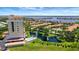 Stunning aerial view featuring resort-style living and a tranquil lake with fountains at 501 Haben Blvd # 506, Palmetto, FL 34221