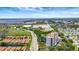Stunning aerial view showing luxury tower, community, water, and green space at 501 Haben Blvd # 506, Palmetto, FL 34221