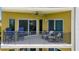 Comfortable balcony with seating and ceiling fan, perfect for enjoying the view and outdoor air at 501 Haben Blvd # 506, Palmetto, FL 34221