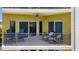 Comfortable balcony with seating and ceiling fan, perfect for enjoying the view and outdoor air at 501 Haben Blvd # 506, Palmetto, FL 34221