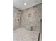 Luxurious bathroom featuring a walk-in shower with dual shower heads and pebble flooring at 501 Haben Blvd # 506, Palmetto, FL 34221