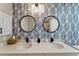 Bathroom featuring double sinks, granite counters, attractive wall paper and modern black fixtures at 501 Haben Blvd # 506, Palmetto, FL 34221