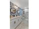 Bathroom featuring double sinks, granite counters, attractive wall paper and modern black fixtures at 501 Haben Blvd # 506, Palmetto, FL 34221