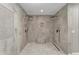 Luxurious bathroom featuring a walk-in shower with dual shower heads and pebble flooring at 501 Haben Blvd # 506, Palmetto, FL 34221