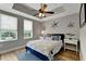 Comfortable bedroom featuring hard wood floors, modern lighting, and decorations at 501 Haben Blvd # 506, Palmetto, FL 34221