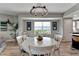 Bright dining room featuring white table set, chandelier, and view of the outdoors at 501 Haben Blvd # 506, Palmetto, FL 34221