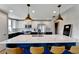 Modern kitchen boasts two-tone cabinets, stainless steel appliances, and a large island with seating at 501 Haben Blvd # 506, Palmetto, FL 34221
