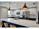 Modern kitchen boasts two-tone cabinets, stainless steel appliances, and a large island with seating at 501 Haben Blvd # 506, Palmetto, FL 34221