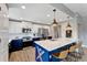 Modern kitchen boasts two-tone cabinets, stainless steel appliances, and a large island with seating at 501 Haben Blvd # 506, Palmetto, FL 34221