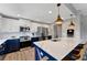 Modern kitchen boasts two-tone cabinets, stainless steel appliances, and a large island with seating at 501 Haben Blvd # 506, Palmetto, FL 34221