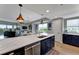 Open concept kitchen with large island flows to living room with great views at 501 Haben Blvd # 506, Palmetto, FL 34221